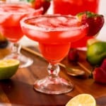 Red iced beverage in a margarita glass.