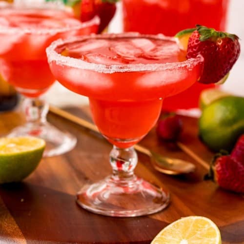 Red iced beverage in a margarita glass.