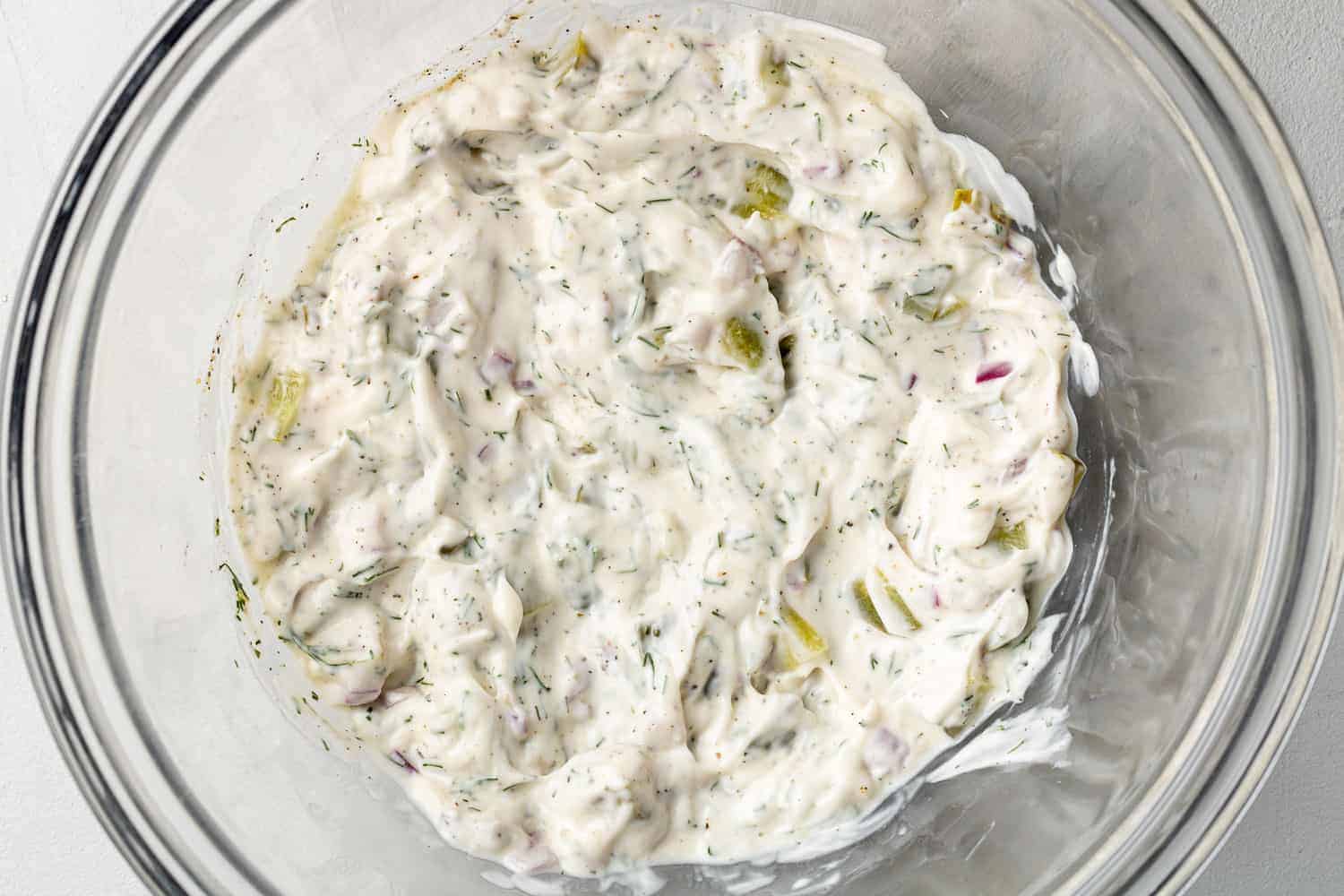 Tartar sauce combined in a mixing bowl.