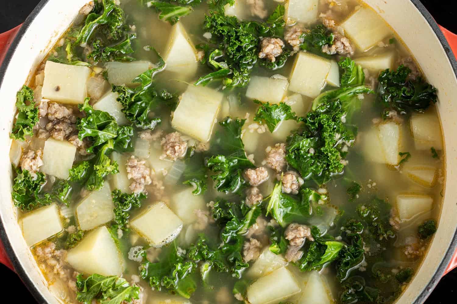 Kale, sausage, and potatoes in the broth.