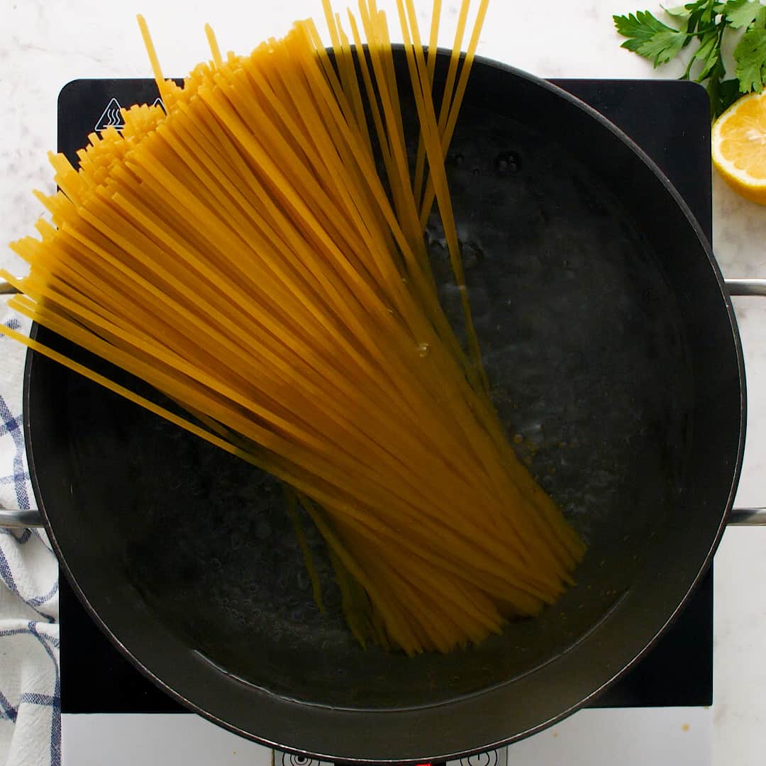 Pasta in a large black pot.