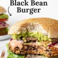 Close up of a vegetarian burger, text overlay reads "the best black bean burger."