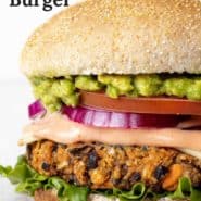 Close up of a vegetarian burger, text overlay reads "the best black bean burger."