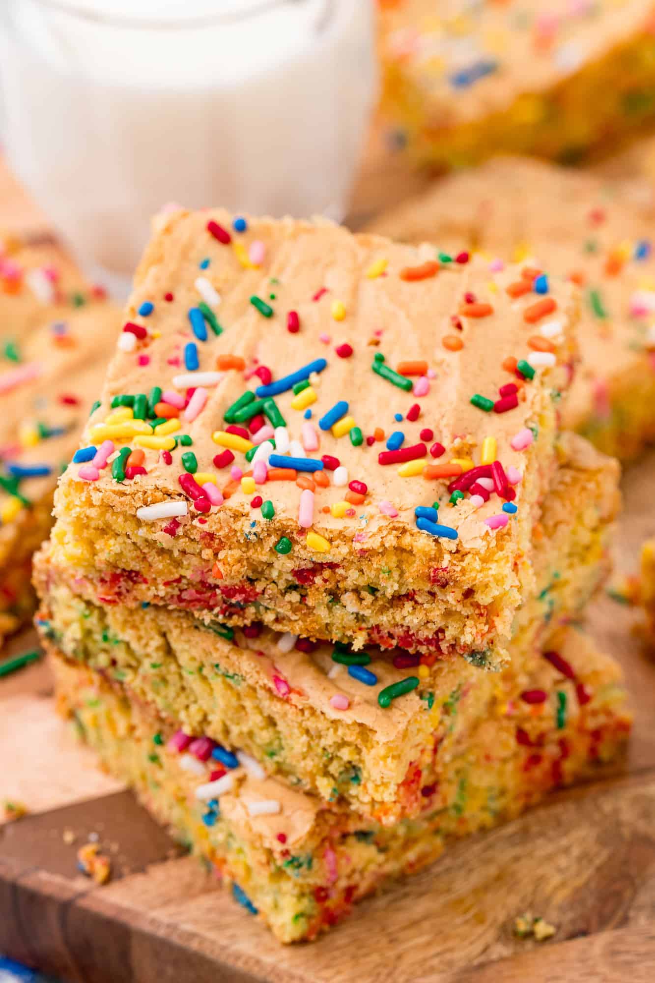Three cake mix blondies with sprinkles stacked on top of each other.