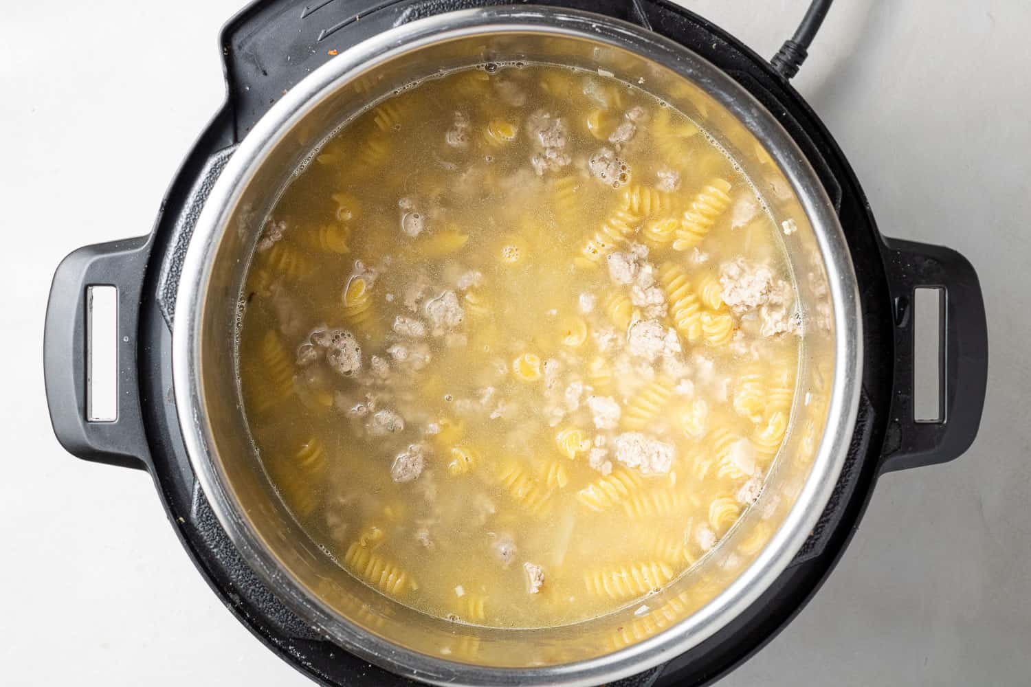 Uncooked pasta in an instant pot.