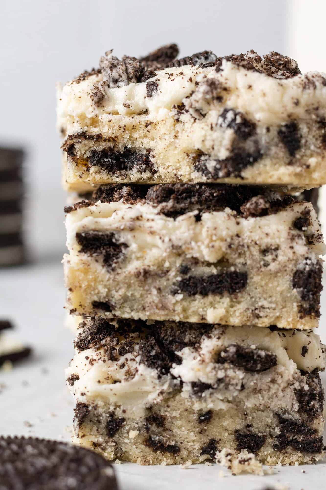 Stack of three frosted oreo cookie bars.