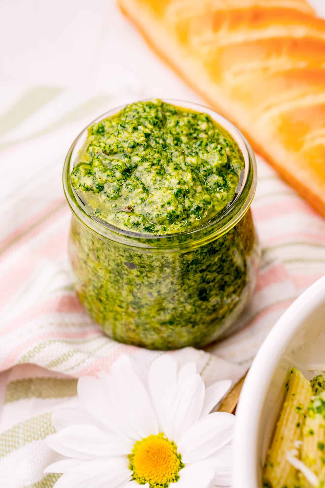 Bright green pesto in a jar.