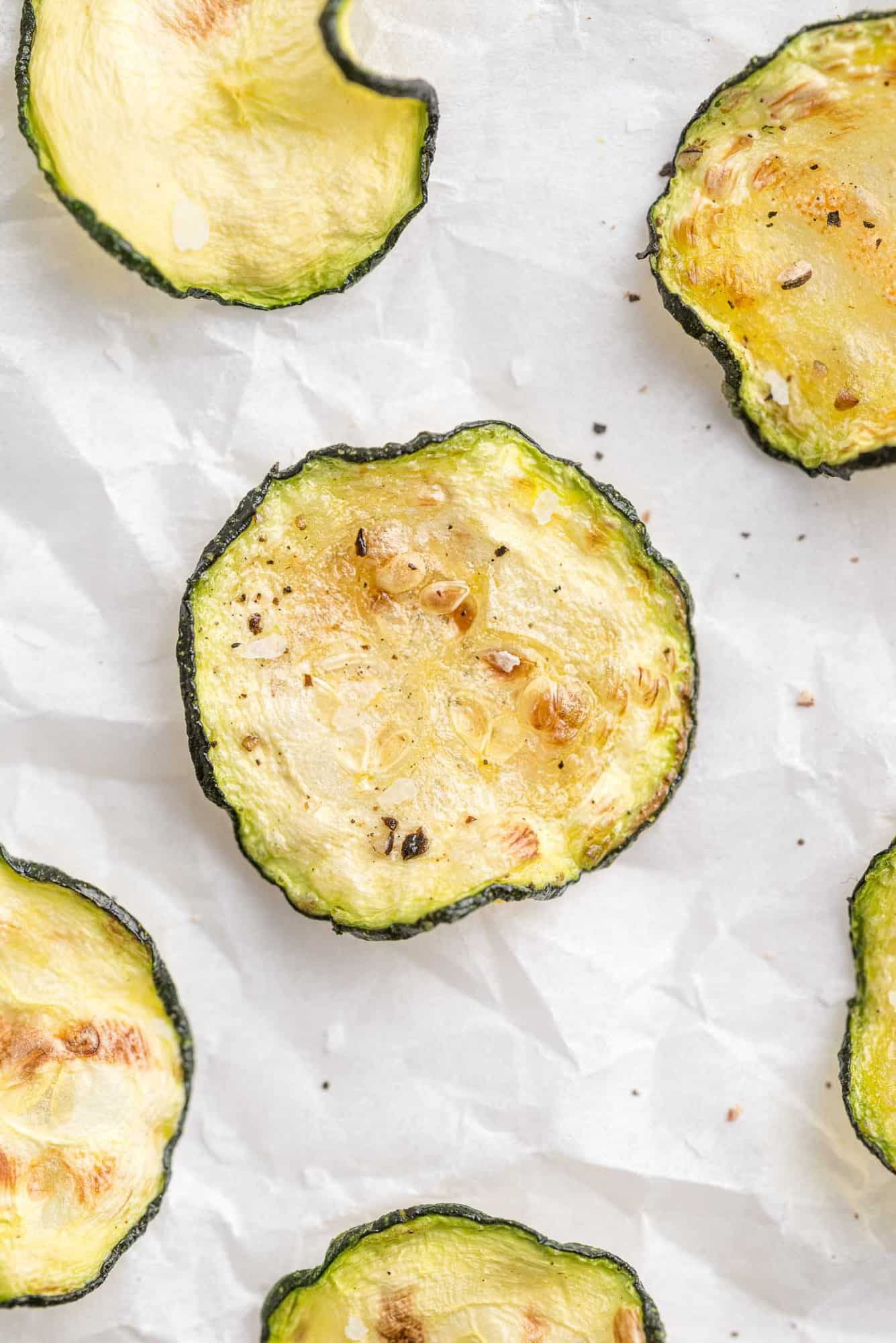 Overhead view of crispy air fryer zucchini chips.