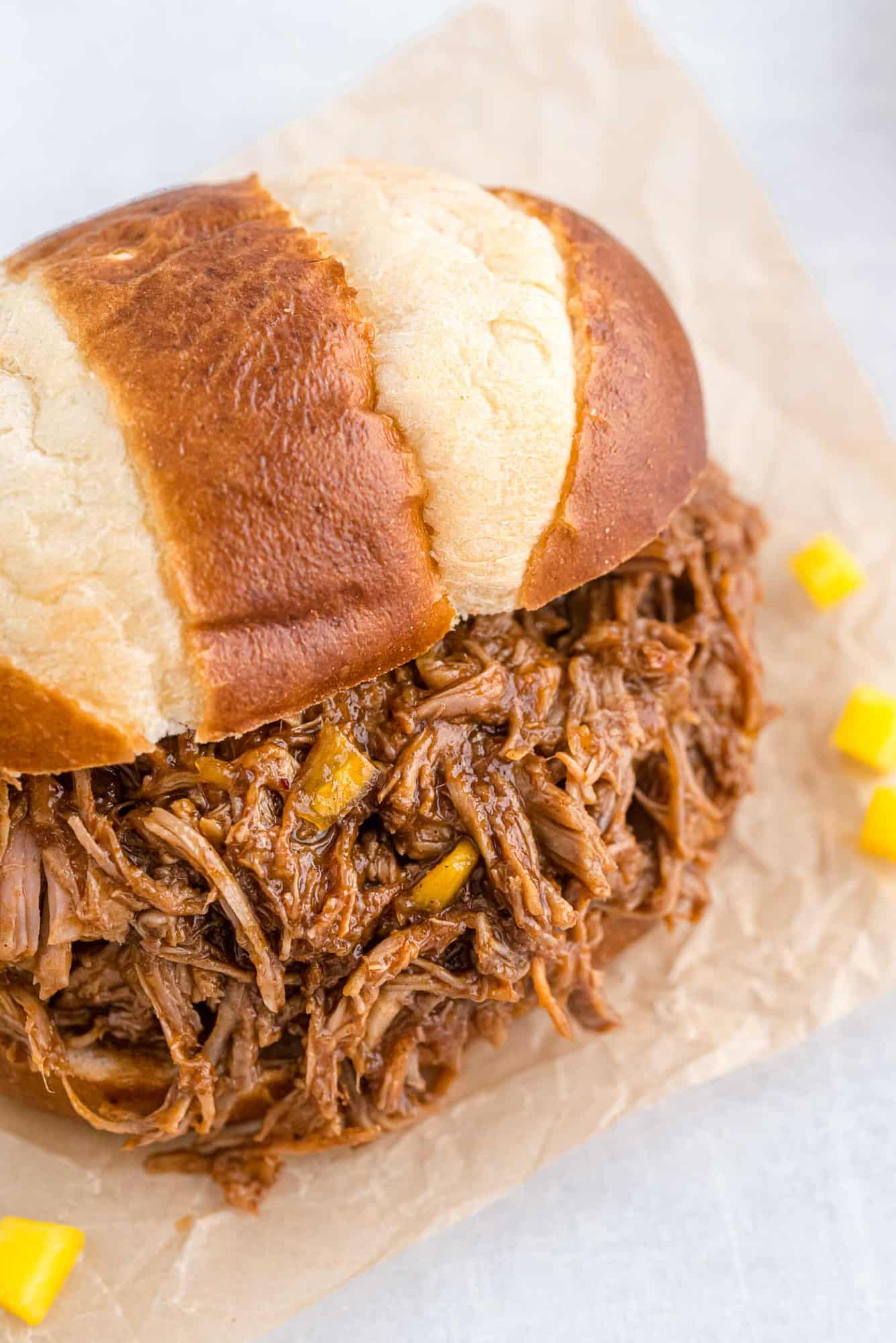 BBQ pulled pork on a pretzel bun.