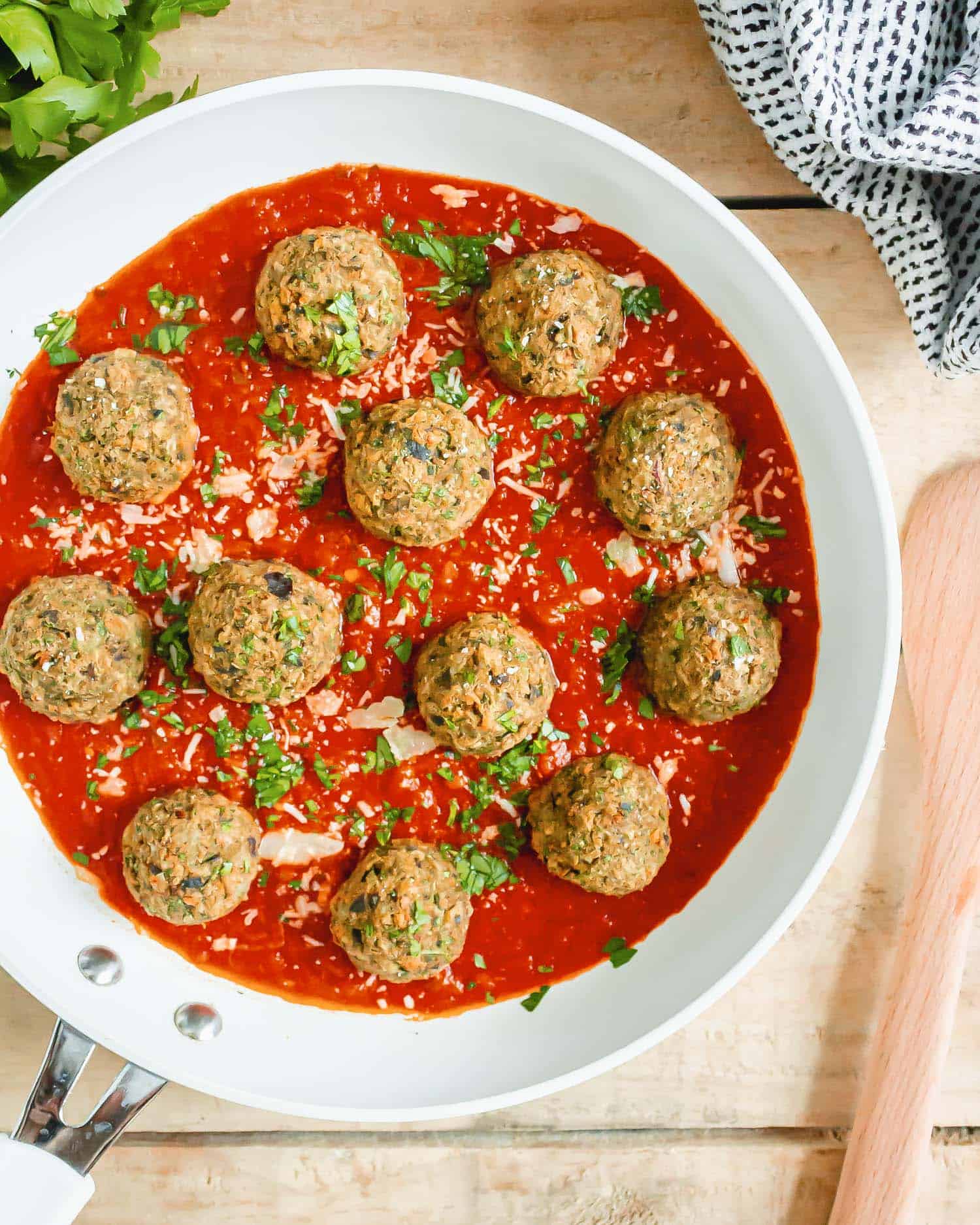 Meatballs and sauce in a frying pan.