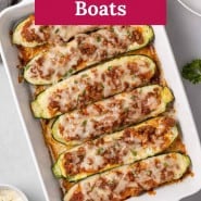 Zucchini with spaghetti sauce, text overlay reads "lasagna zucchini boats."