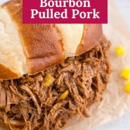 Pulled pork with text overlay that reads "crockpot mango bourbon pulled pork."