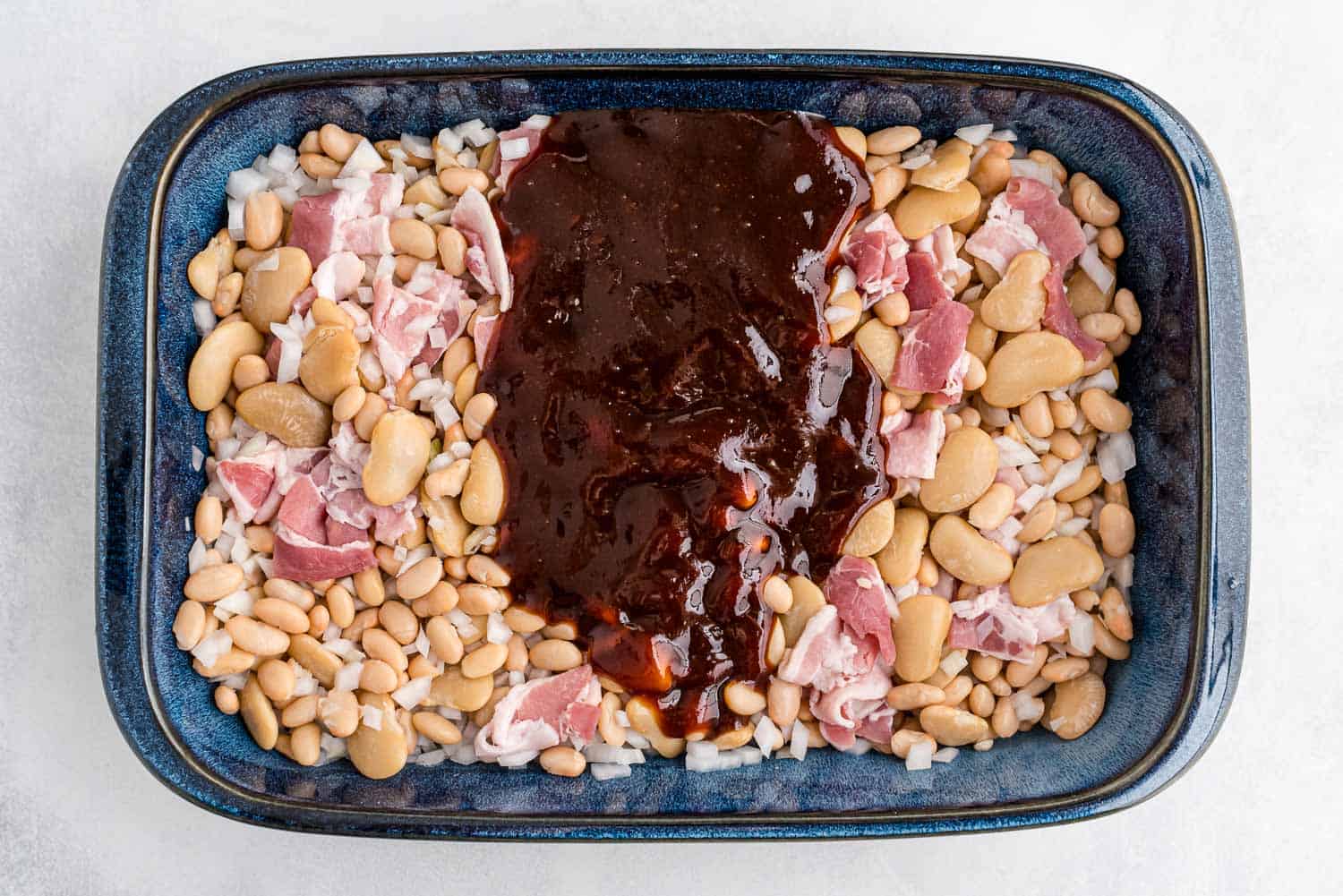 Sauce poured over beans.