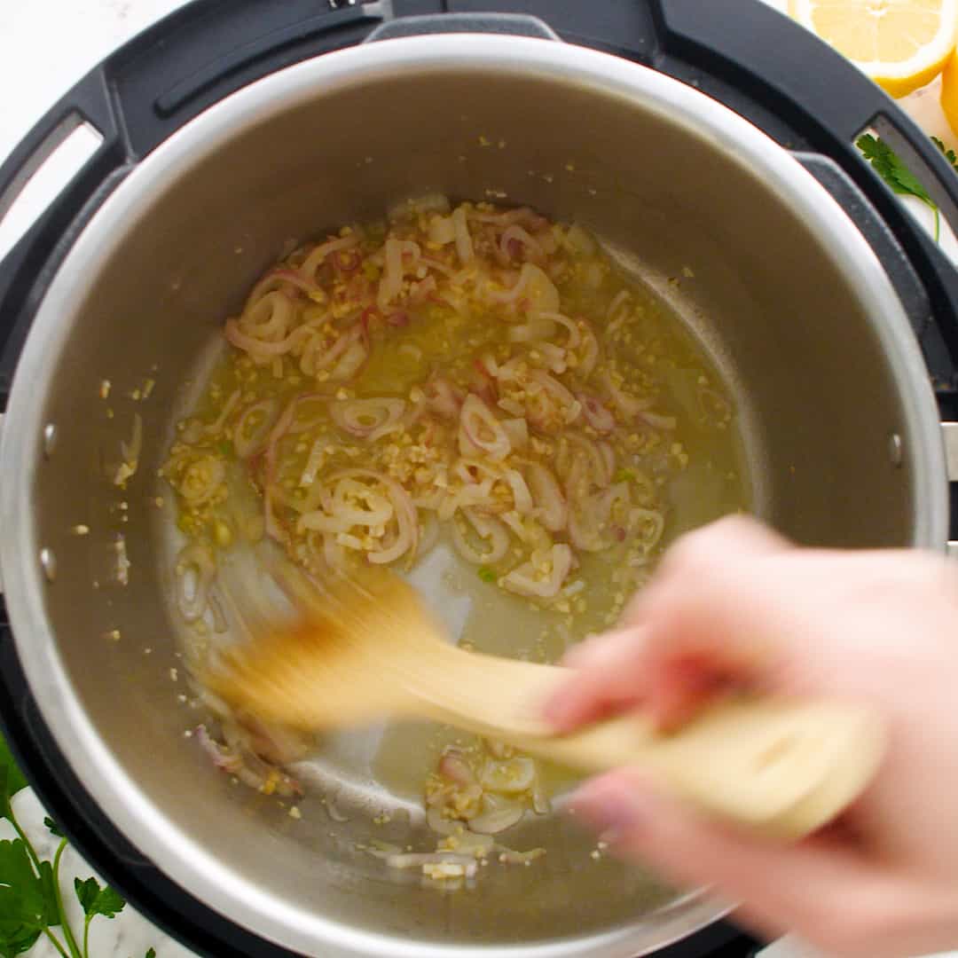 Sautéed shallots and garlic in an instant pot.