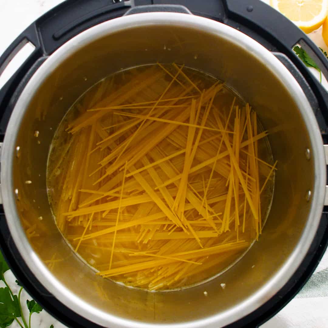 Angel hair pasta in a criss cross pattern in an Instant Pot.