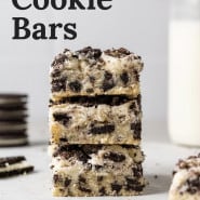 Cookie bars stacked on one another, text overlay reads "oreo cookie bars."