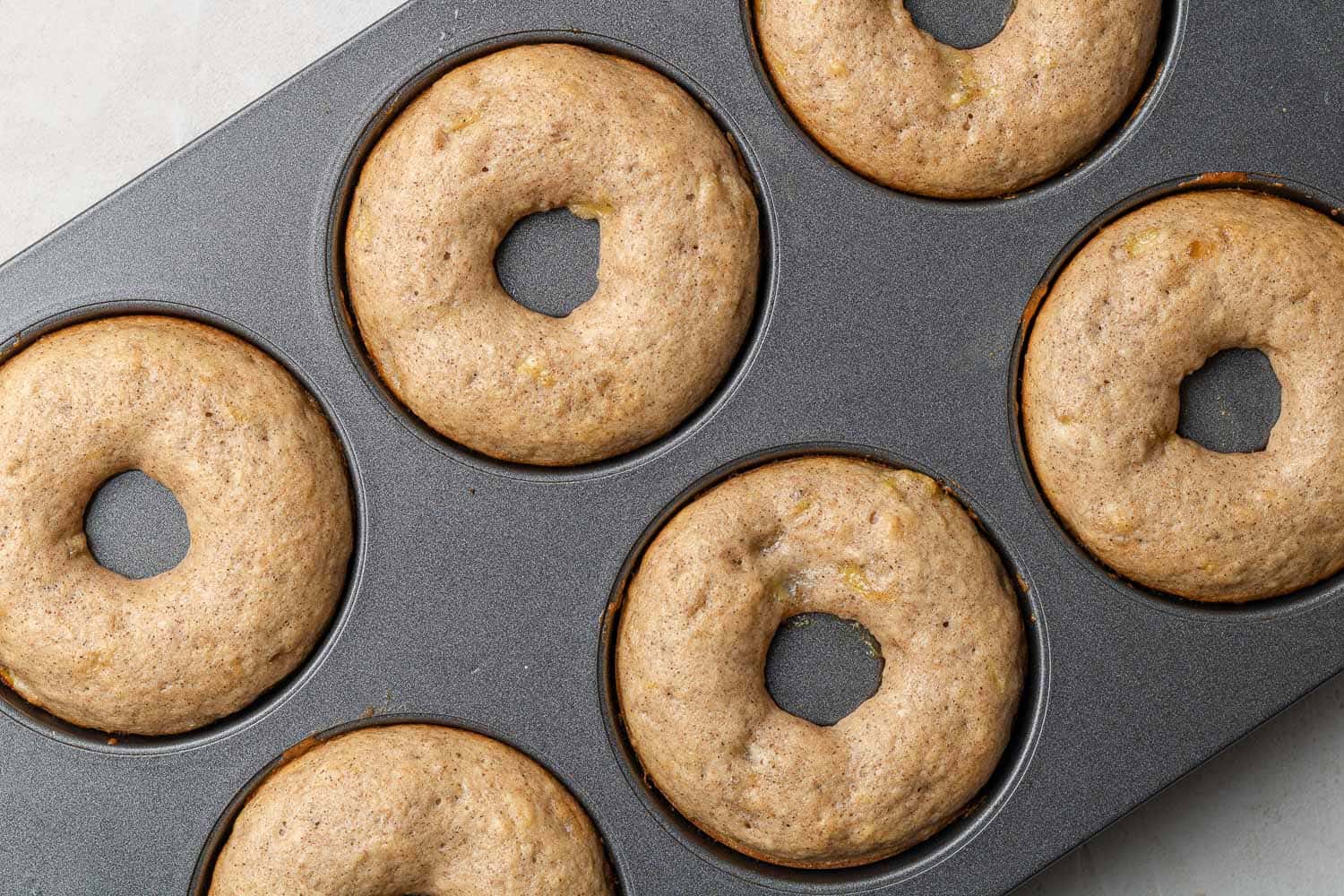 Baked donuts in pan.