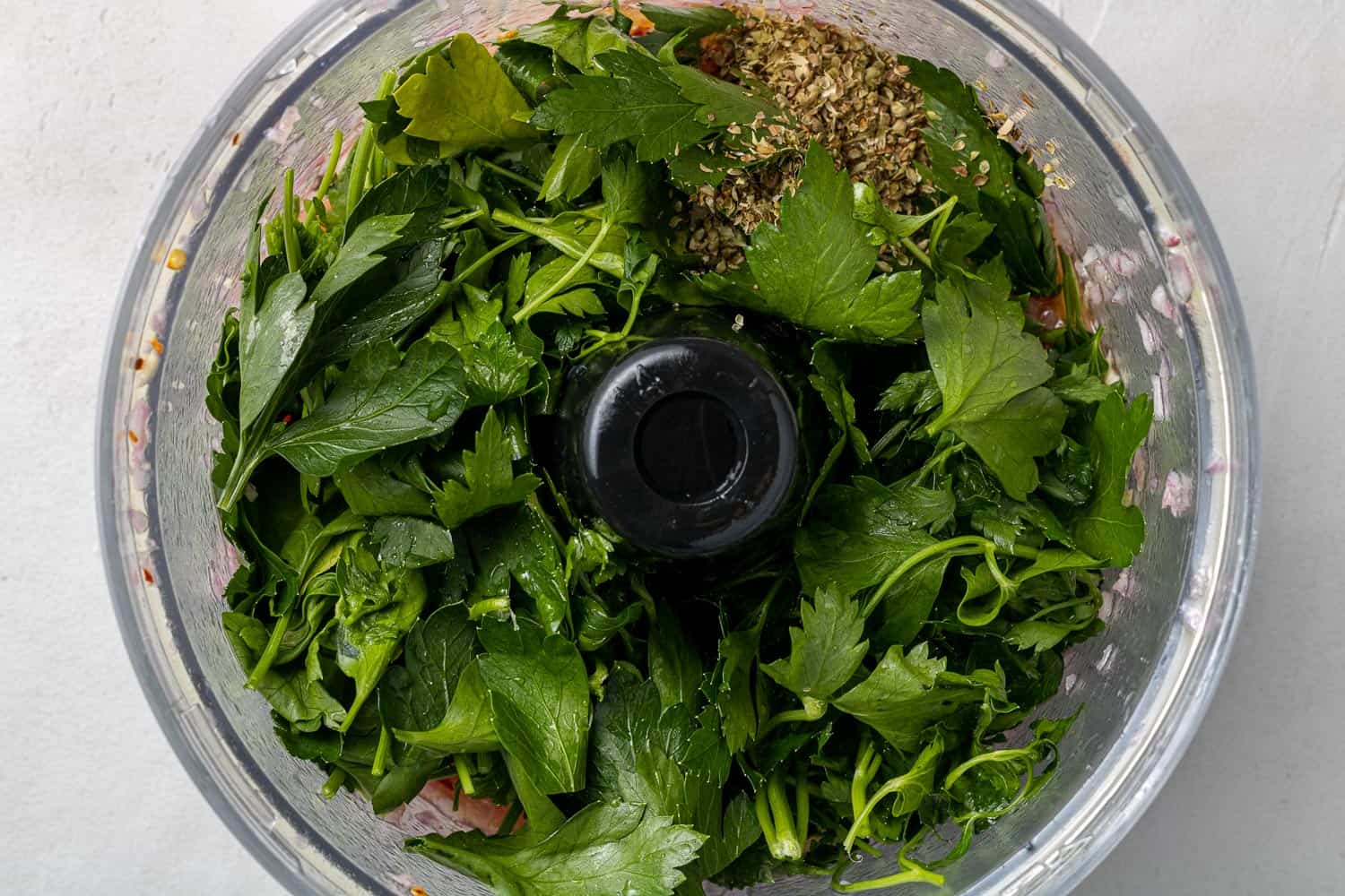 Fresh parsley in a food processor.