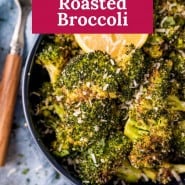 Broccoli in dark colored bowl, text overlay reads "lemon Parmesan roasted broccoli."