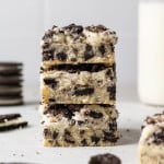Stack of three frosted oreo cookie bars.