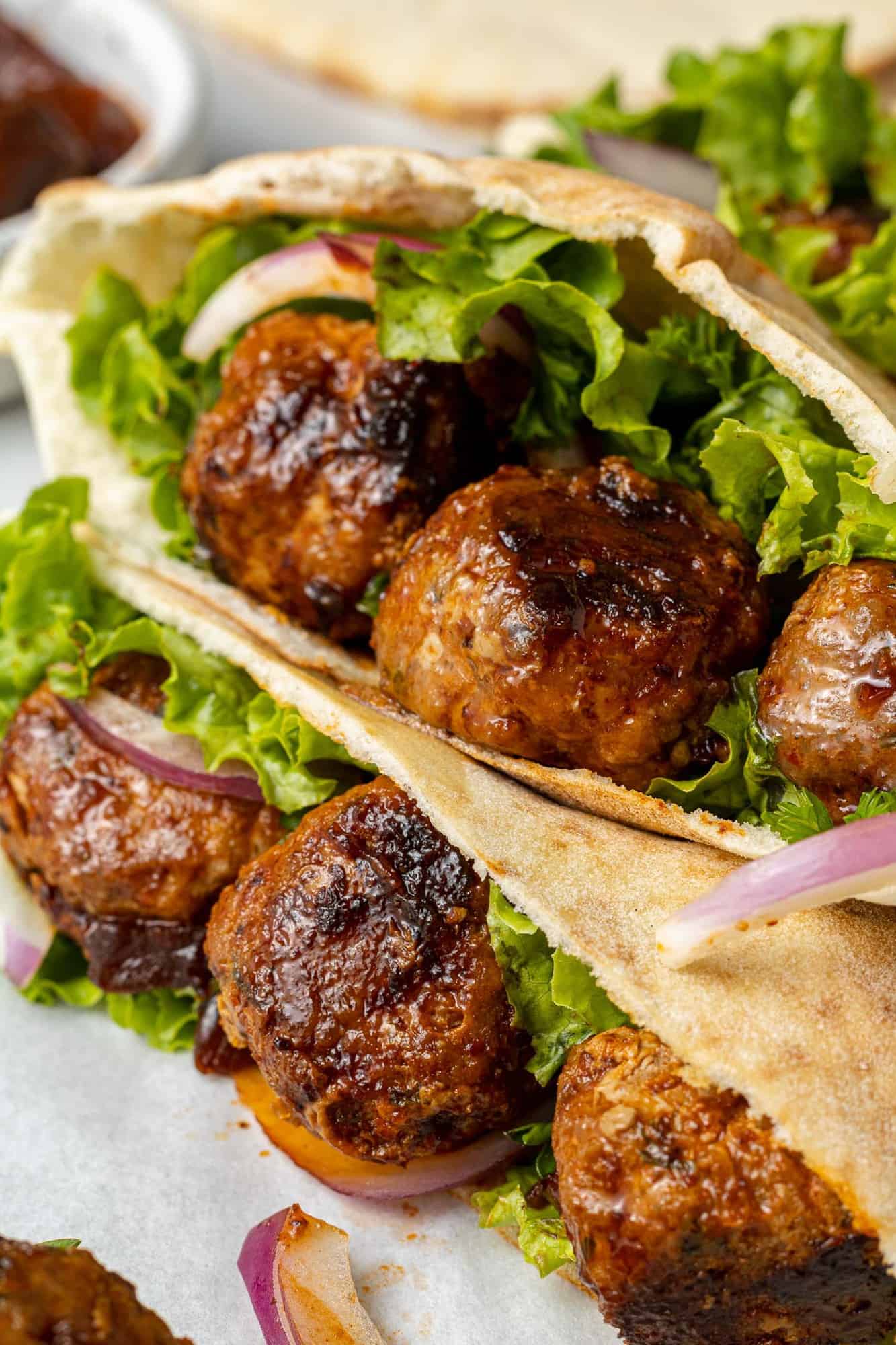 Chipotle glazed meatballs in a pita.