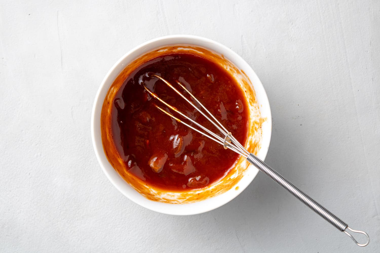 Sauce in a small white bowl.