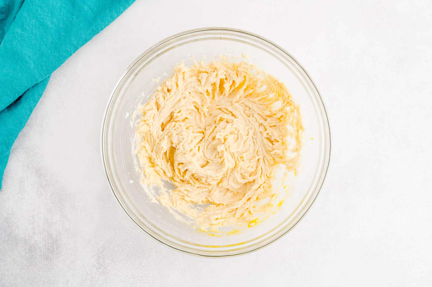 Wet ingredients in a clear glass bowl.