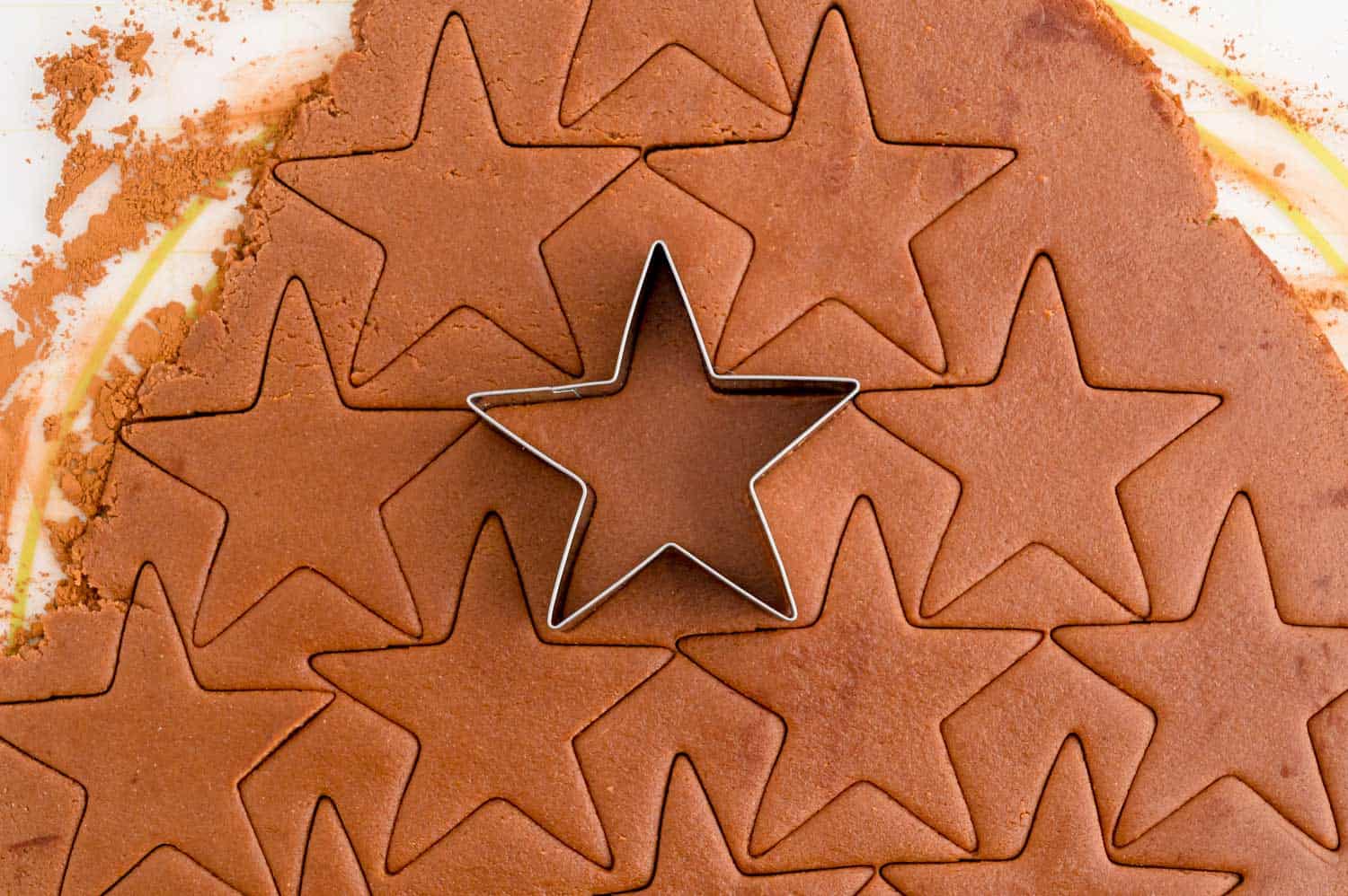 Cookie cutter cutting out a star.