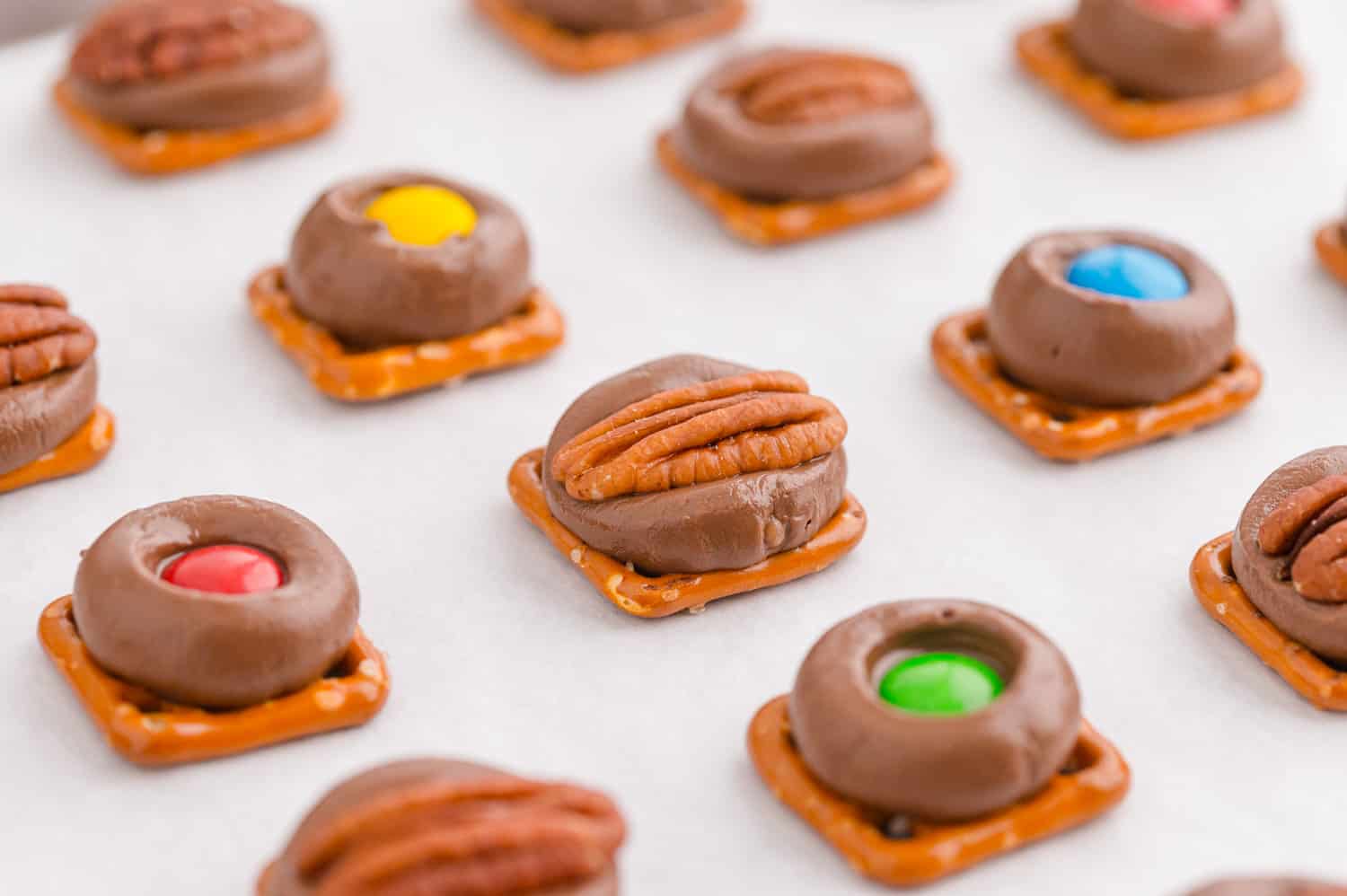 Pretzels, rolos, and pecan halves or M&M's.