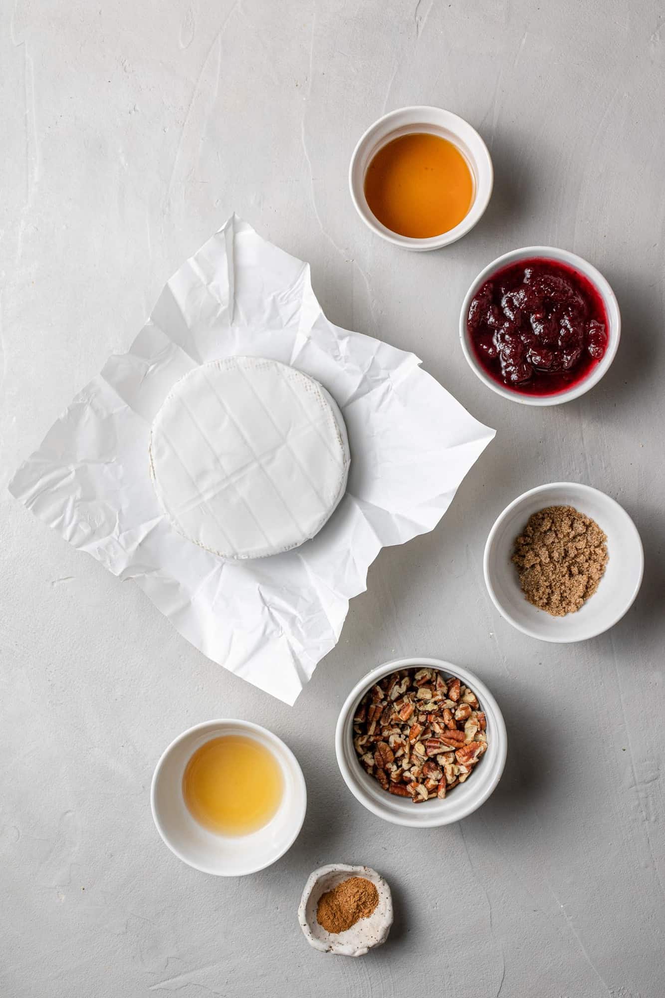 Overhead view of ingredients needed for recipe, including brie.