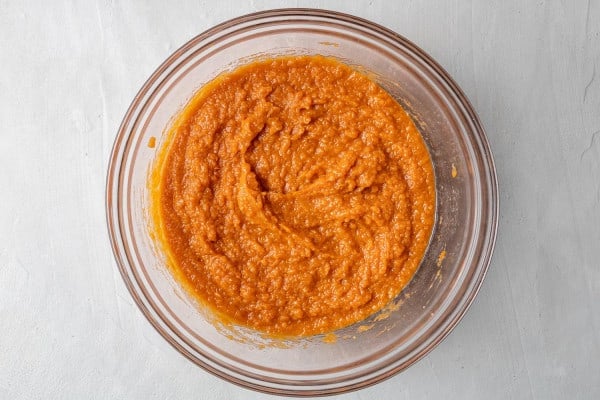 Wet ingredients mixed together in a clear glass bowl.