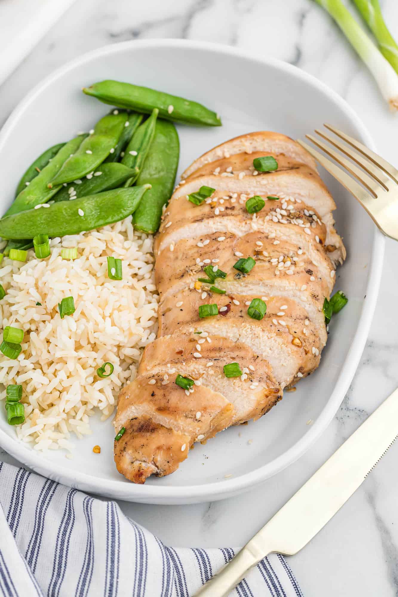 Chicken flavored with Asian chicken marinade, cooked on a plate.