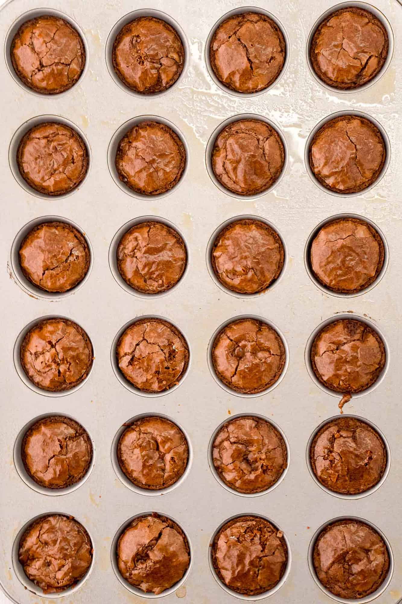 Mini brownies in pan.