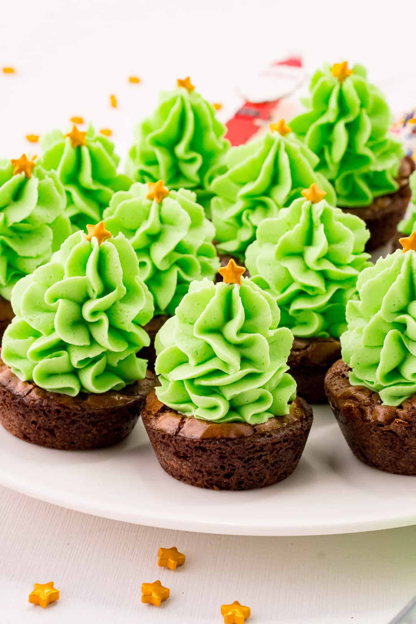 Frosted brownie bites made to look like Christmas trees.