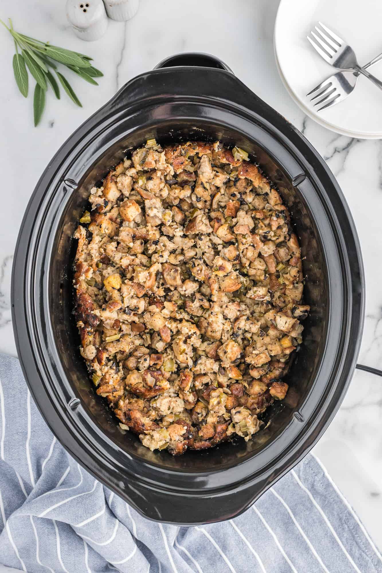 Overhead view of stuffing in a slow cooker.