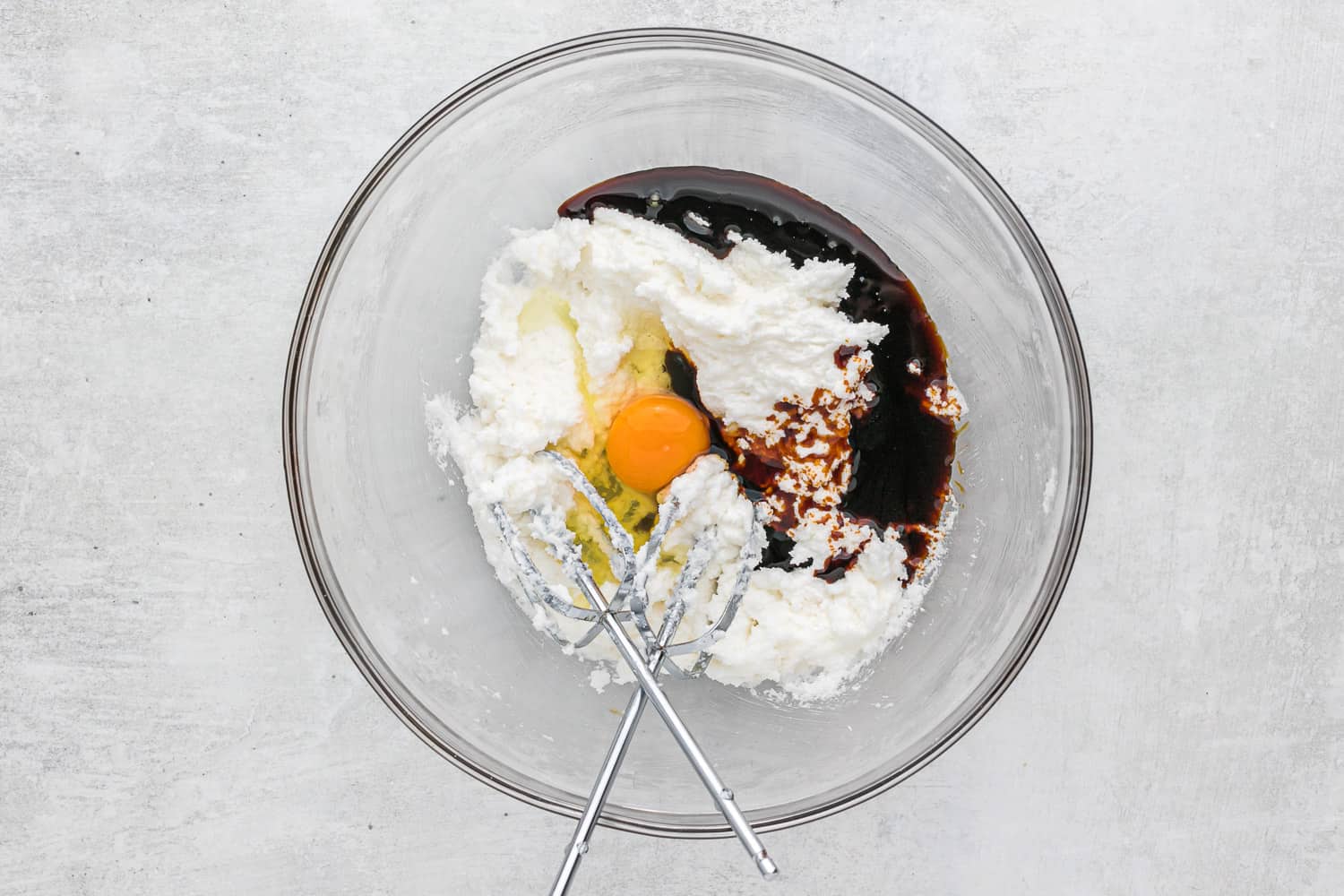 Wet ingredients in clear glass bowl.