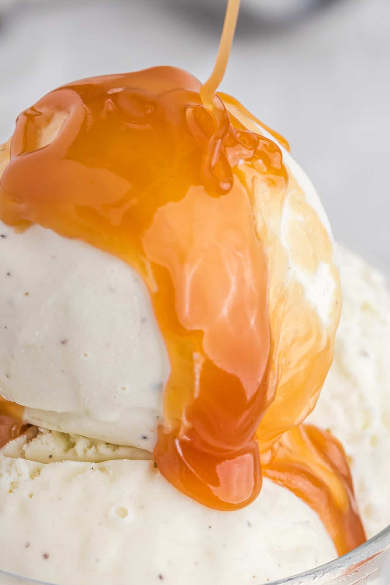 Close up of caramel sauce on ice cream.