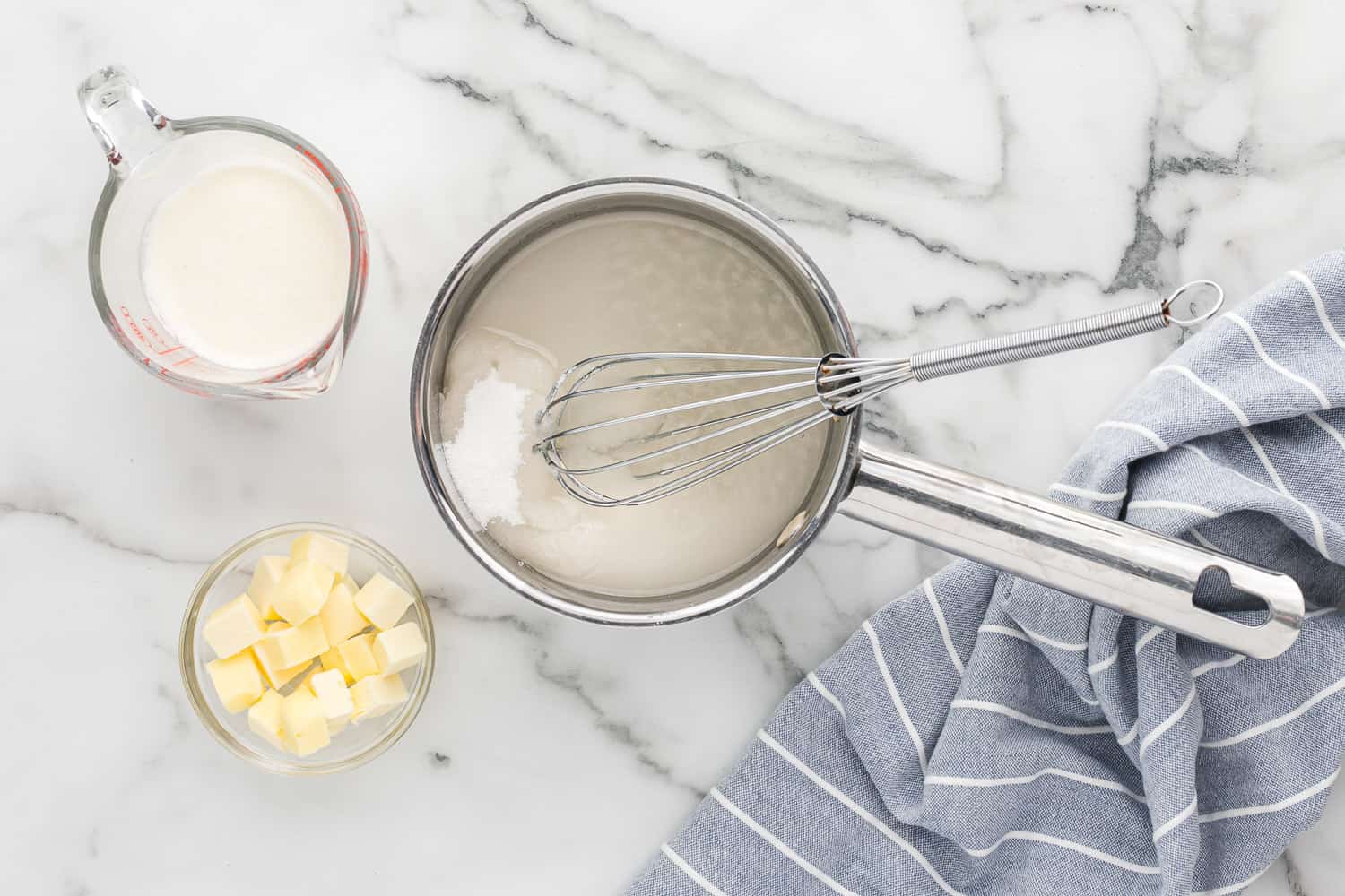 Sugar and water in a saucepan.