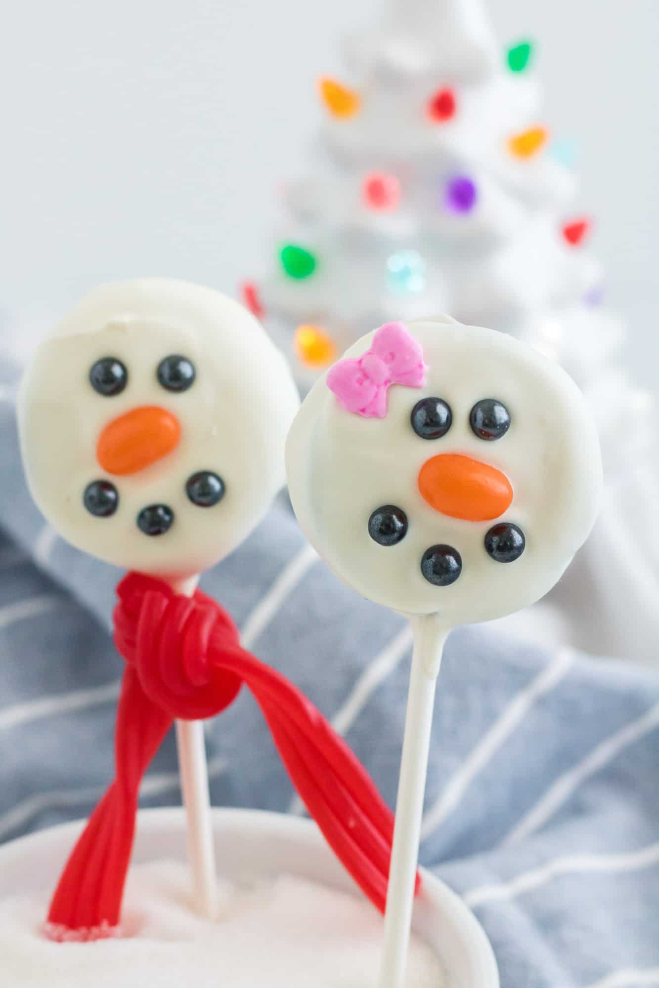 Oreos on sticks, decorated like snowmen.