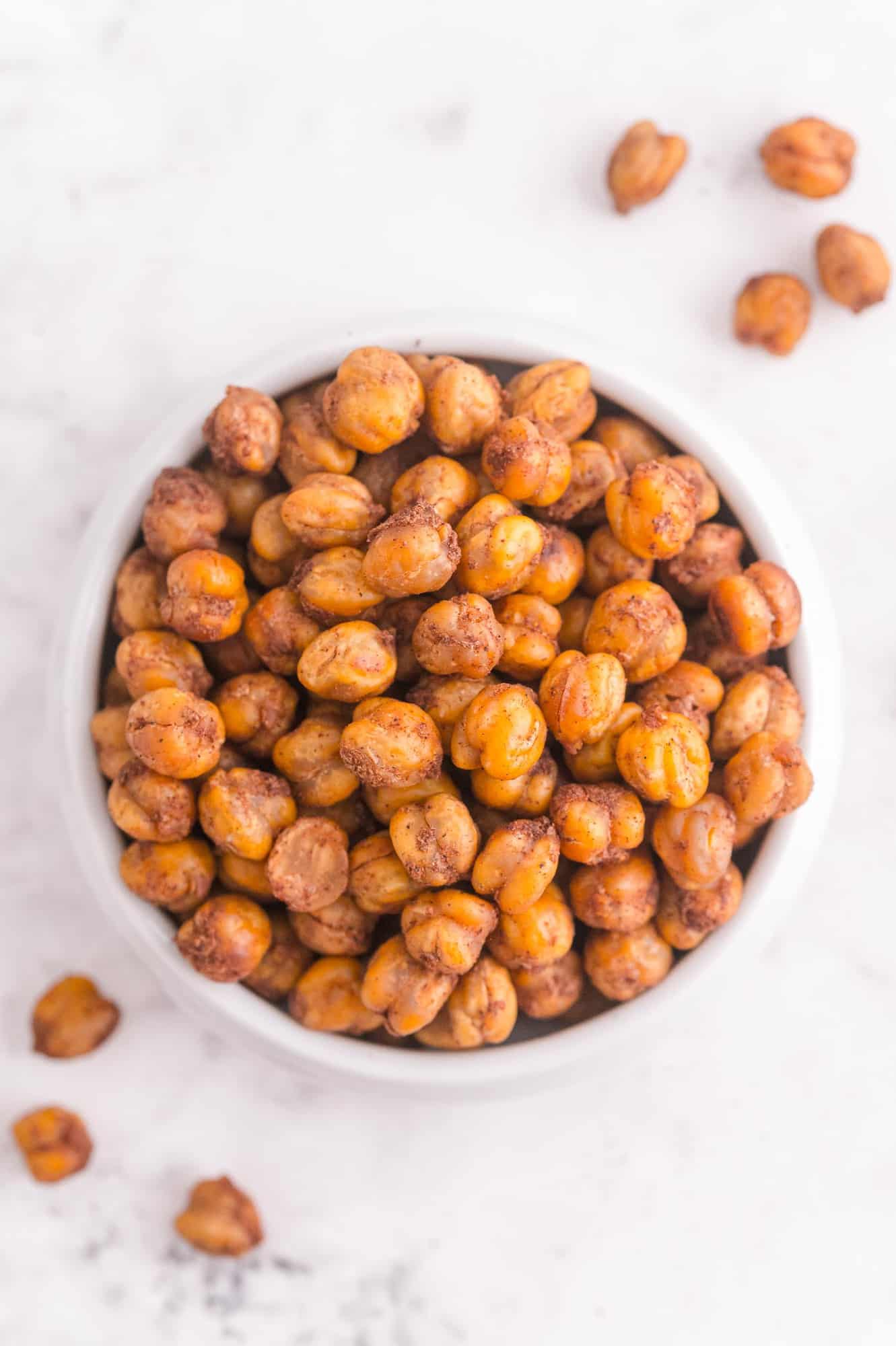 Garbanzo beans with cinnamon in a small white bowl.