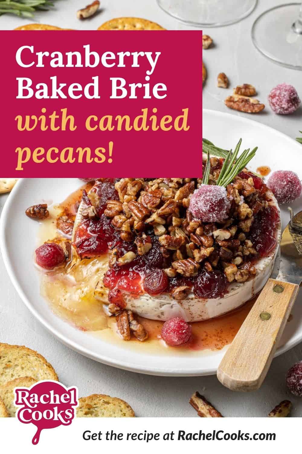 Brie with a text overlay that reads "cranberry baked brie with candied pecans."