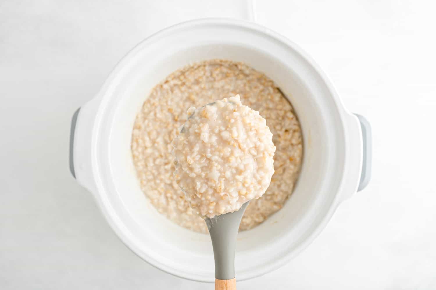 Oatmeal on a serving spoon.