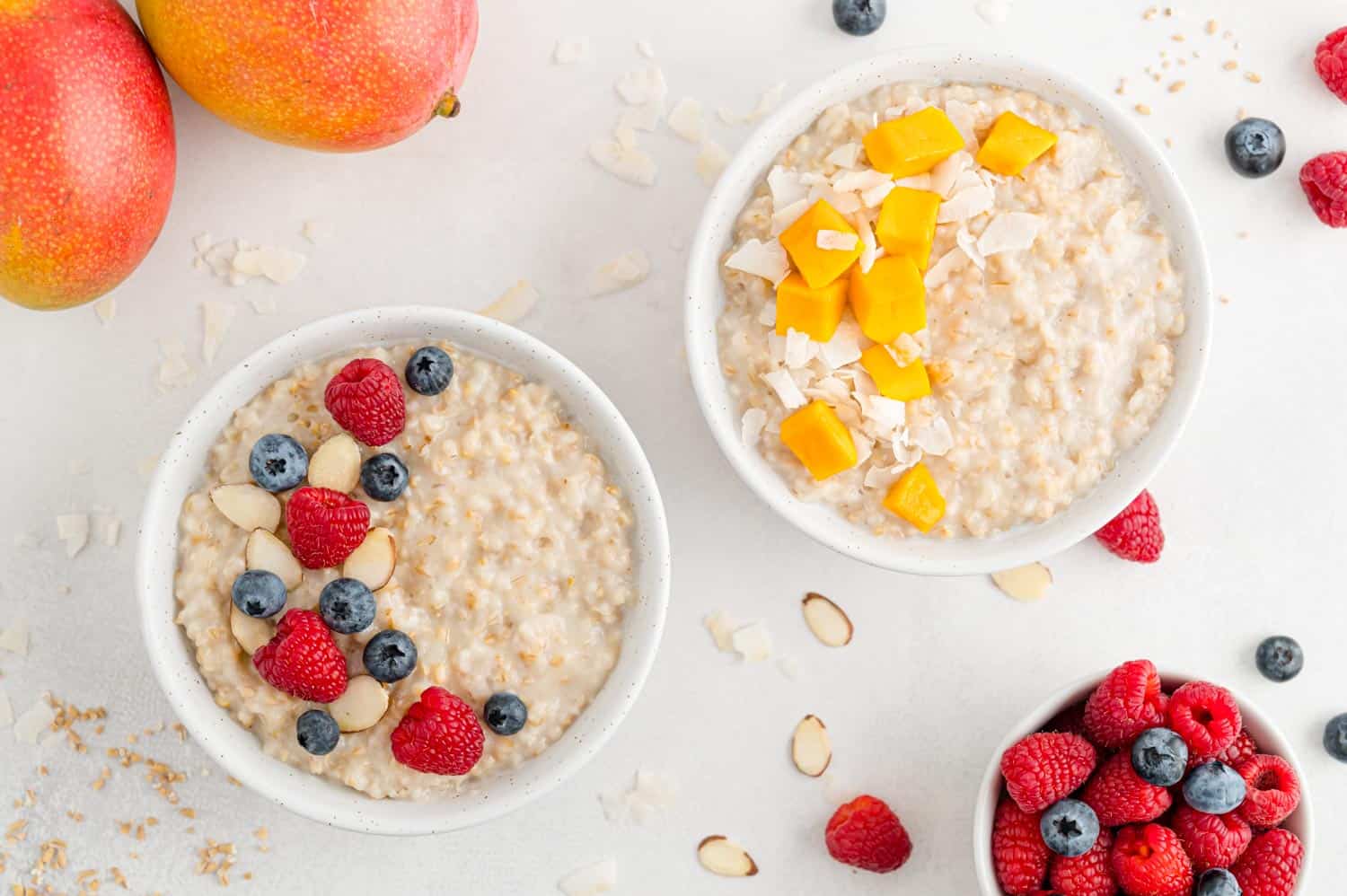 Two bowls of oatmeal with different toppings.