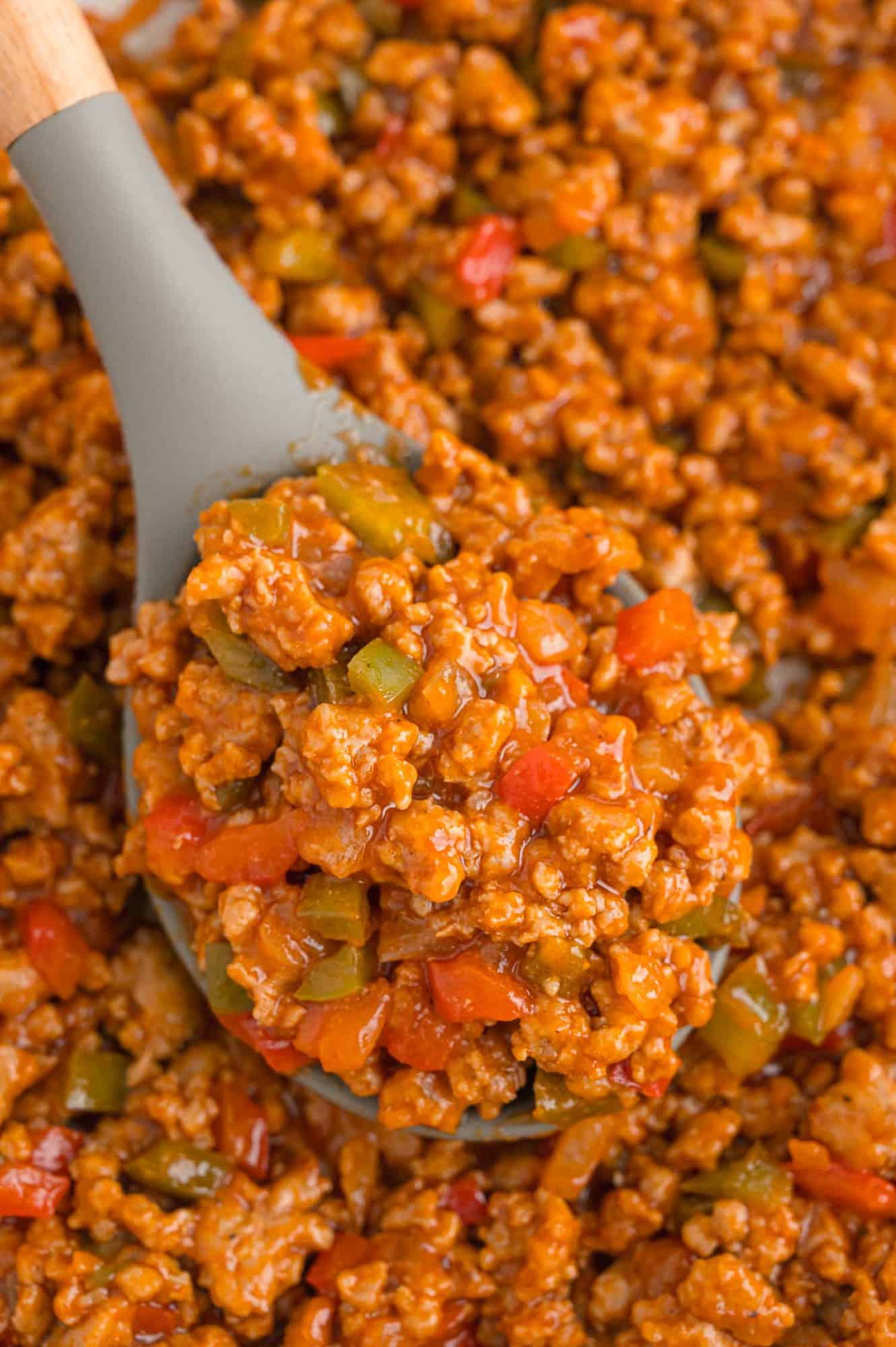 Sloppy Joe meat in a large serving spoon.