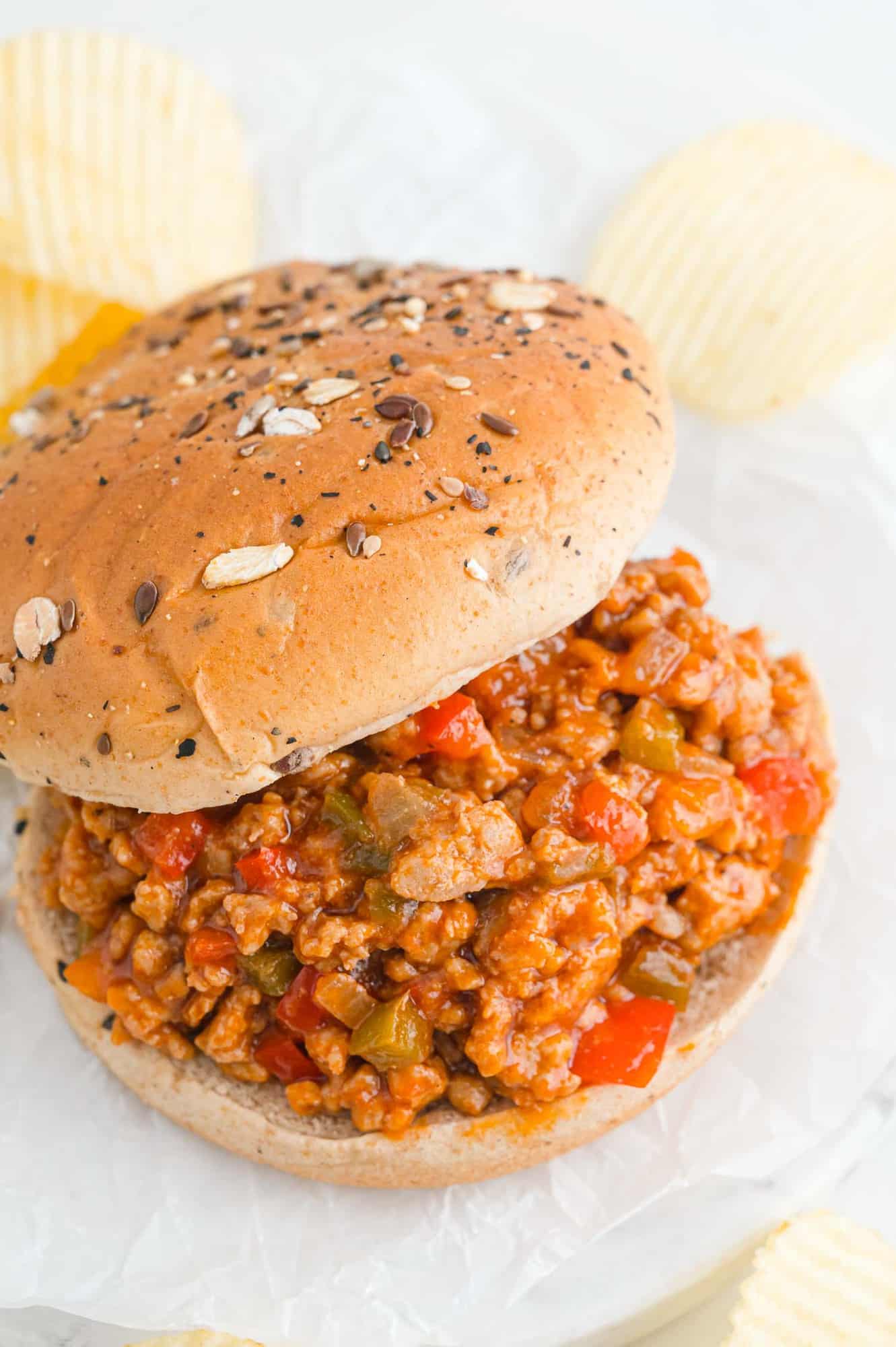 sloppy-joe Sloppy Joe sandwich, top of bun moved to the side to show filling.