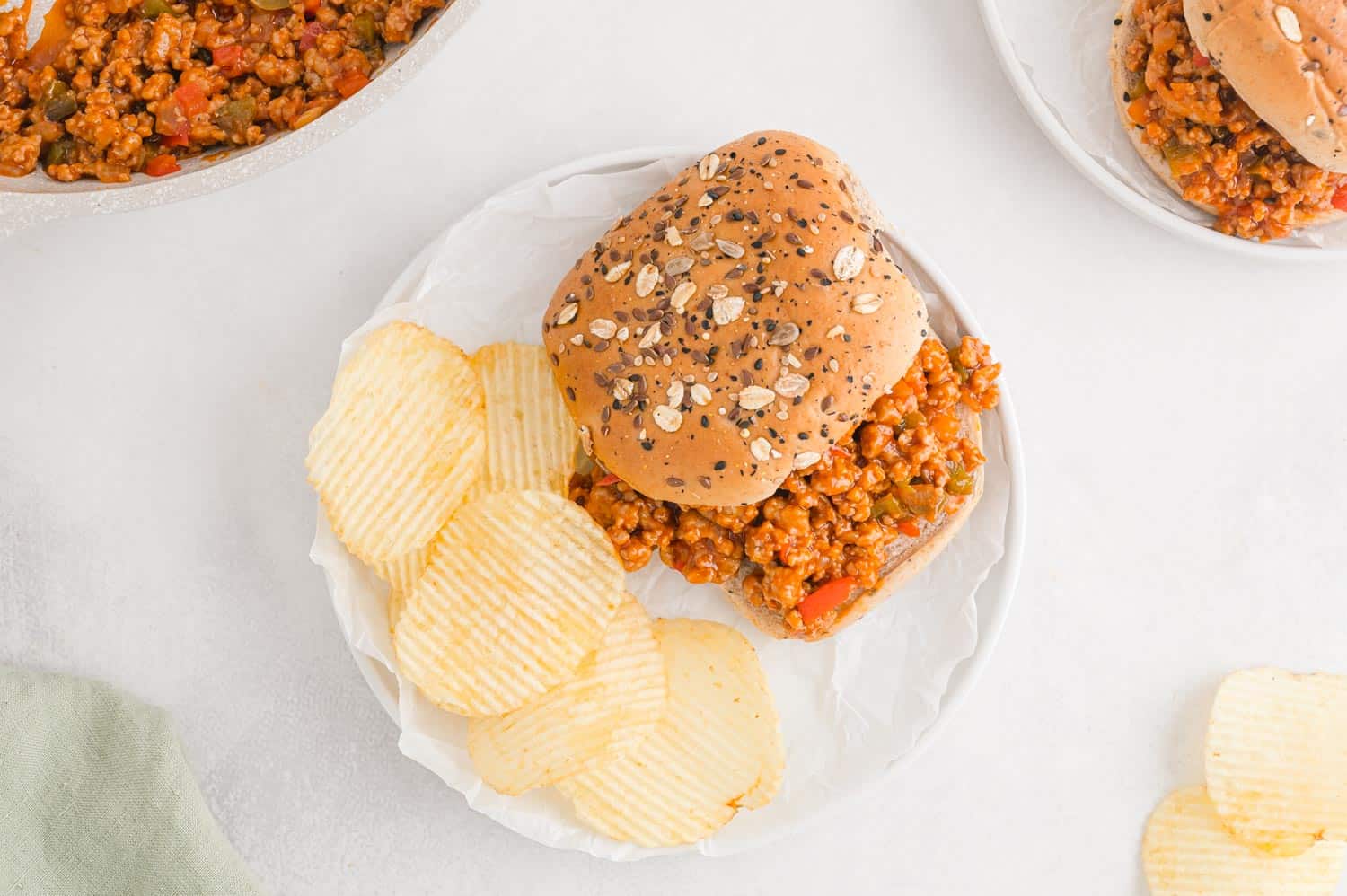 Sloppy joe sandwich with chips.