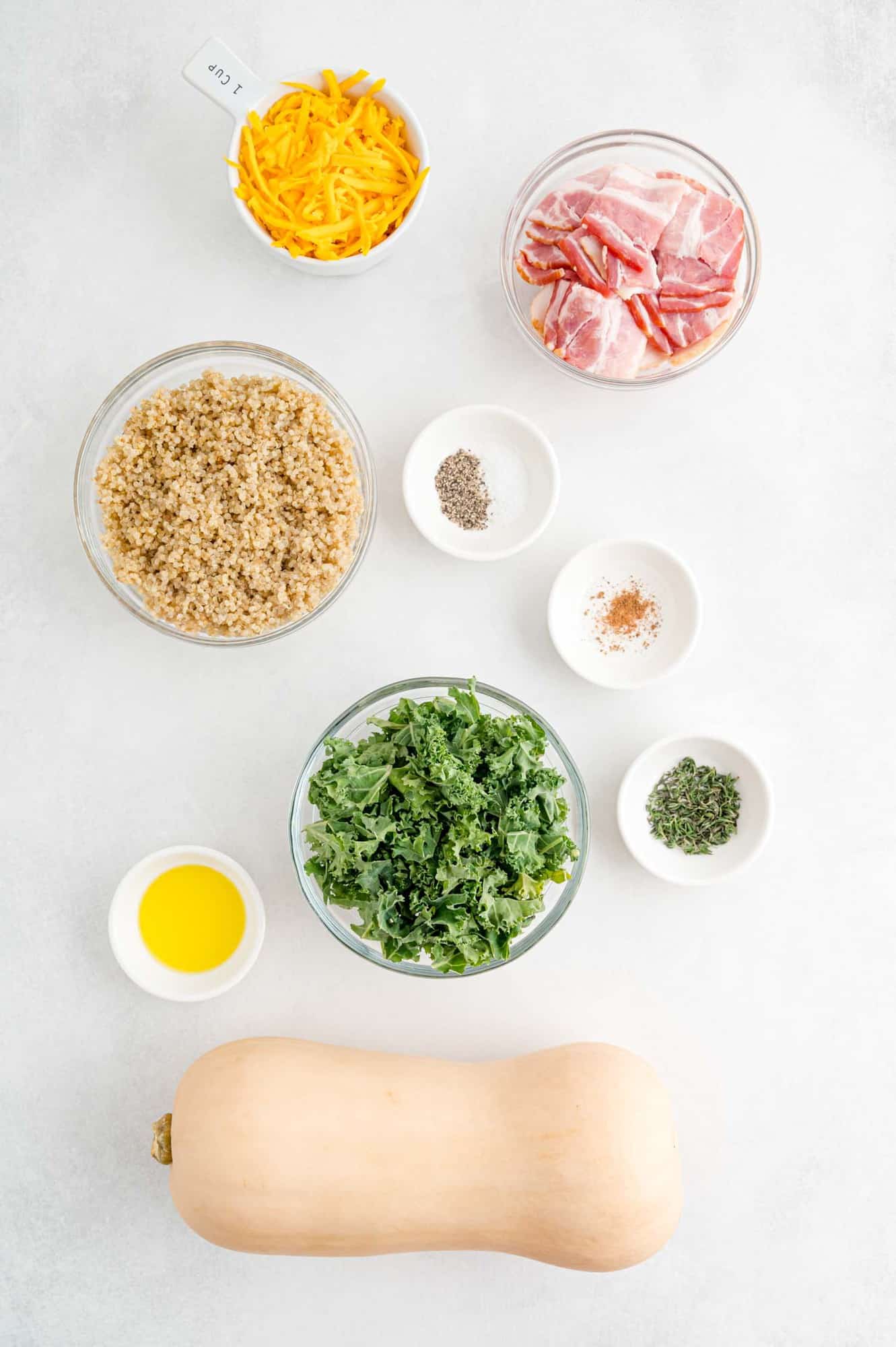 Overhead view of ingredients needed including a whole squash.