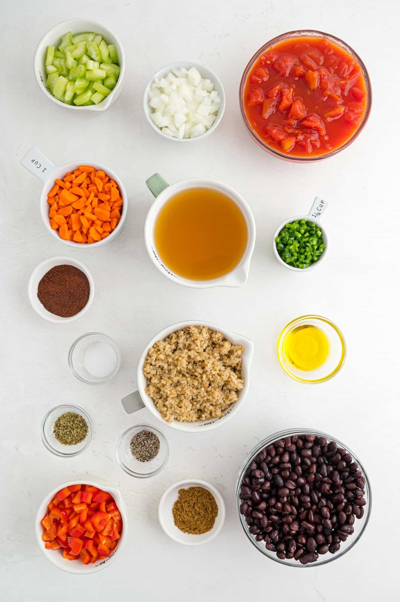 Overhead view of ingredients in separate bowls including quinoa.