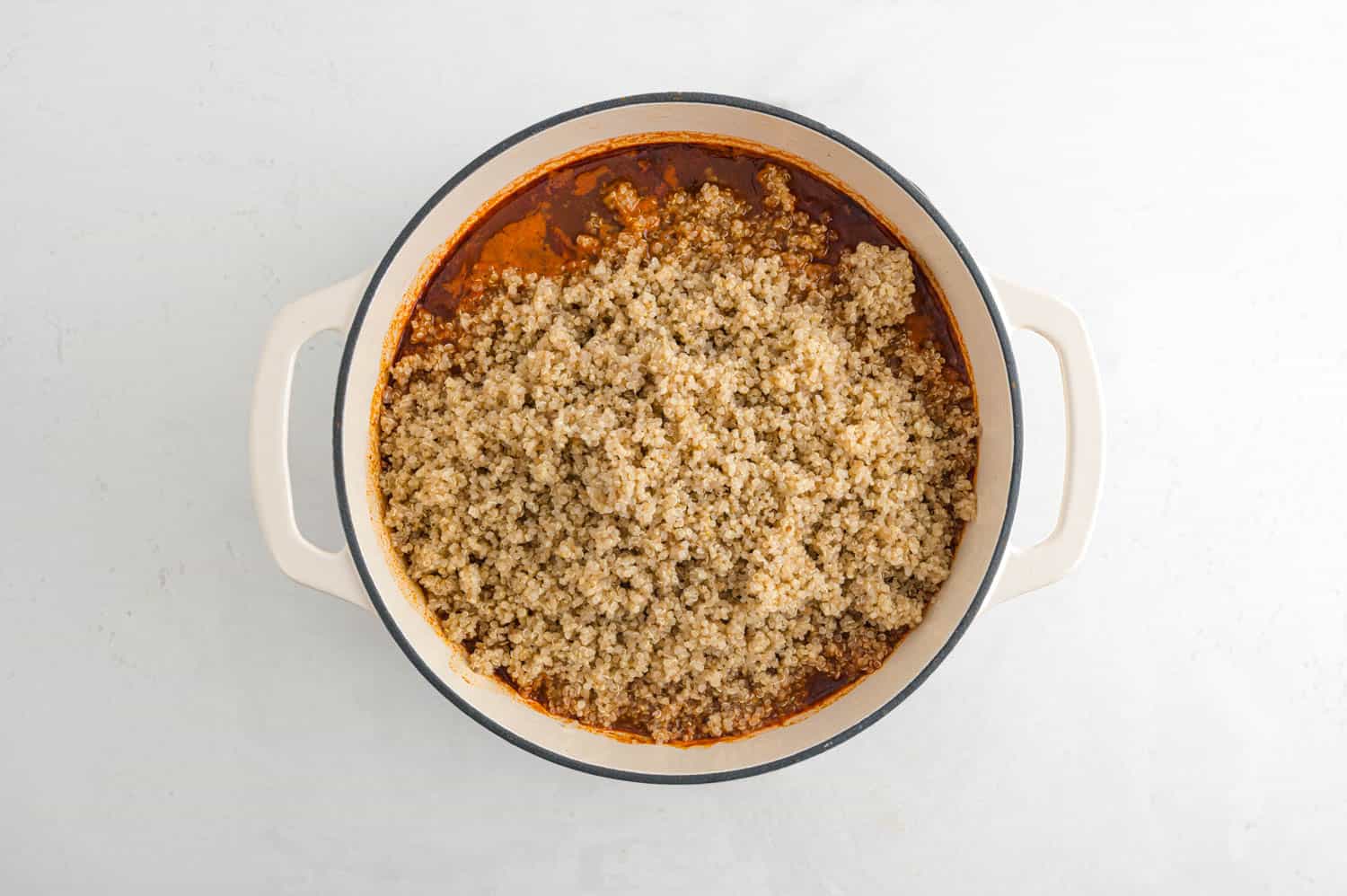 Quinoa added to the top of chili.