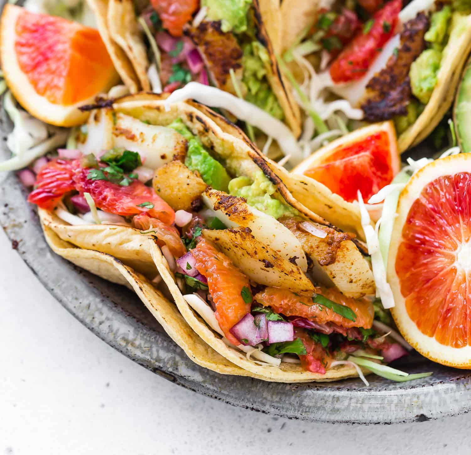 Close up of fish taco in a double corn tortilla.